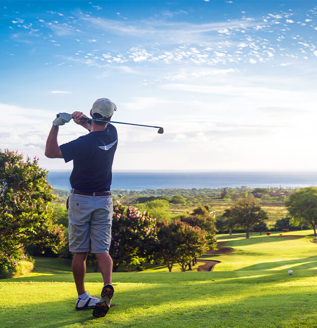 golfer swinging on green