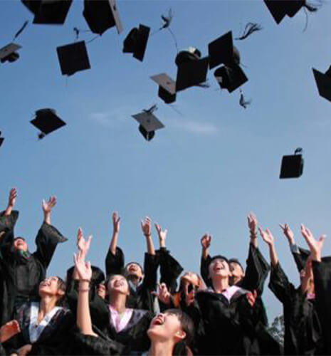 graduates throwing hats